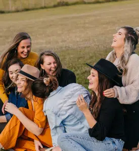 Women Laughing Together In A Park